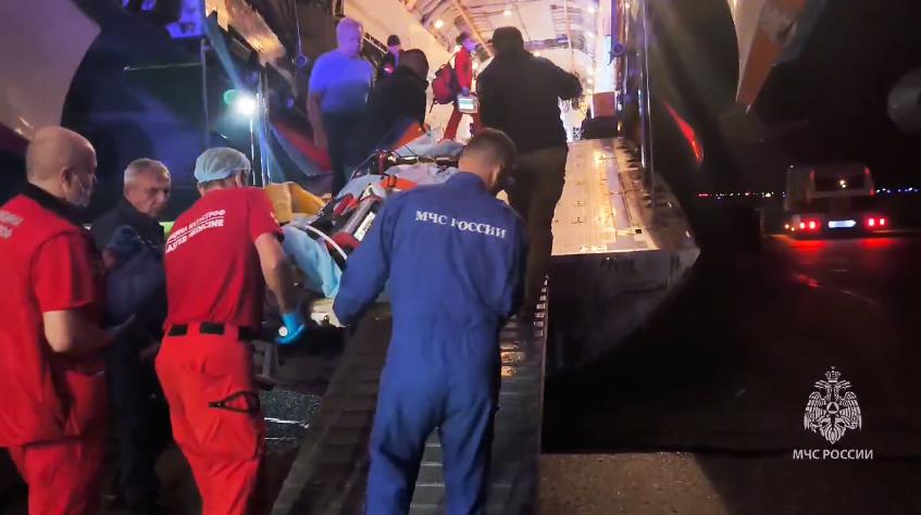In this image made from video provided by Russian Emergency Situations Ministry press service, medical and rescue workers put those injured in a fire at the Amur Gas Chemical Complex on a plane to Moscow in Blagoveschensk, Amur region, Russia, Thursday, Aug. 27, 2026. (Ministry of Emergency Situations press service via AP)