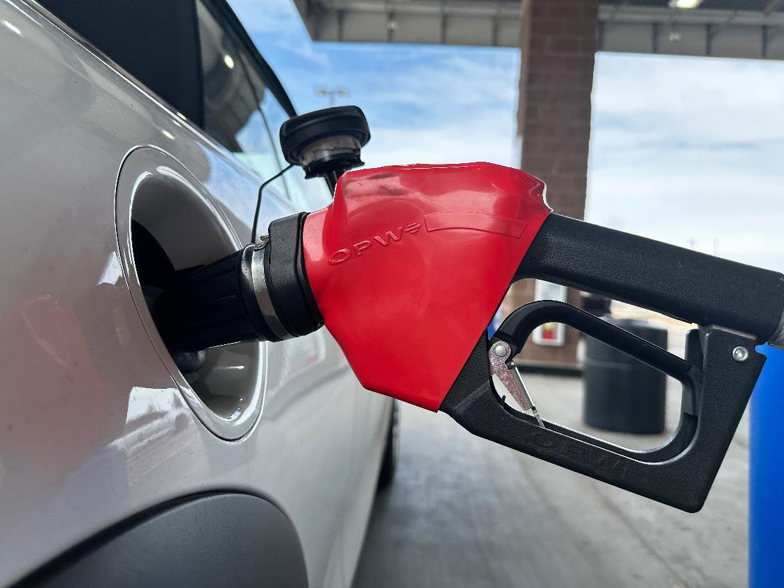 A motorist fills up the tank of a vehicle at a Coscto gasoline station Thursday, March 12, 2026, in east Denver. (AP Photo/David Zalubowski)