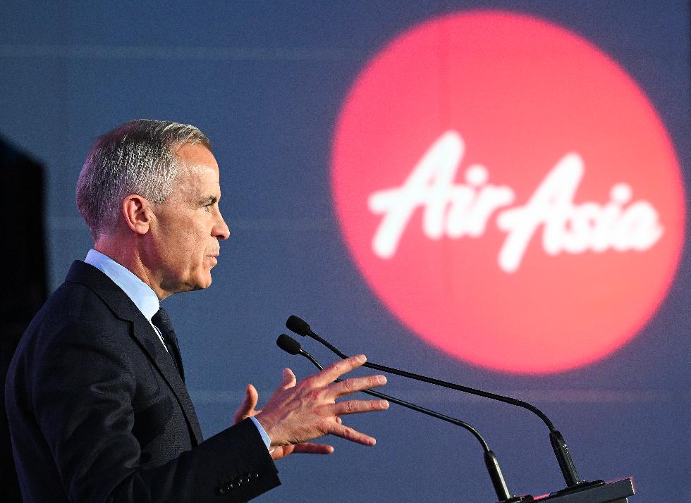 Canada's Prime Minister Mark Carney speaks during an event at the Airbus A220 Delivery Center in Mirabel, Que., Wednesday, May 6, 2026, where AirAsia placed a landmark order for 150 Airbus A220 aircraft. (Graham Hughes/The Canadian Press via AP)