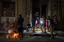 A man prepares caldosa, a traditional soup, during a birthday celebration on the street in Havana, Thursday, March 5, 2026. (AP Photo/Ramon Espinosa)