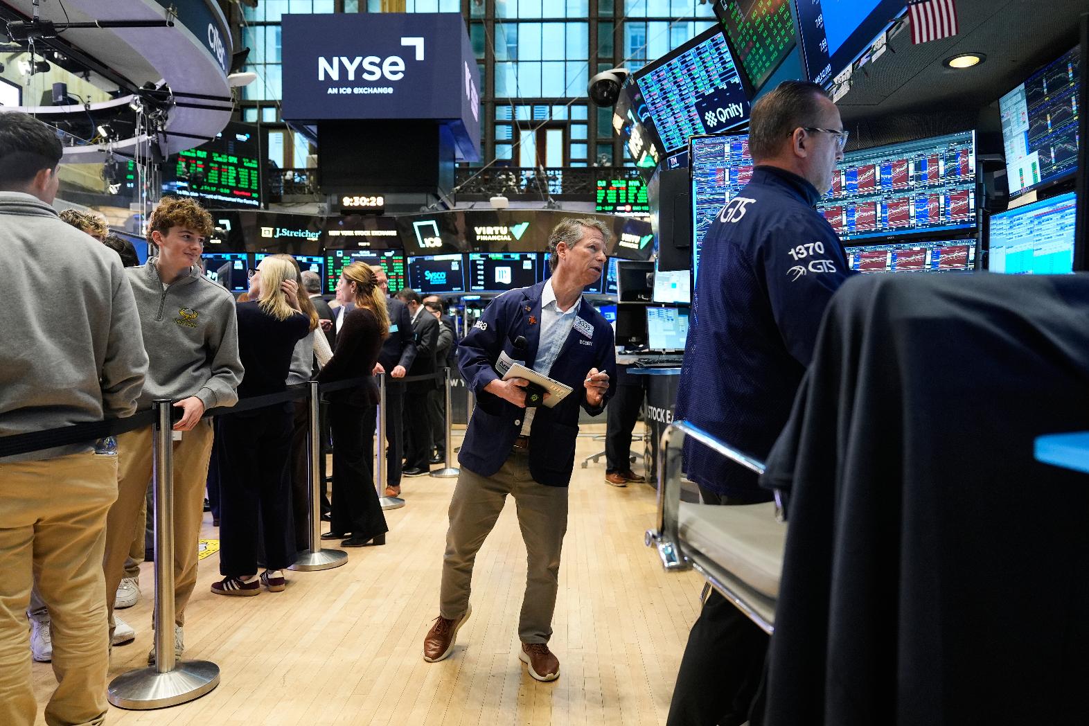 Bobby Charmak works on the floor at the New York Stock Exchange in New York, Monday, March 30, 2026. (AP Photo/Seth Wenig)