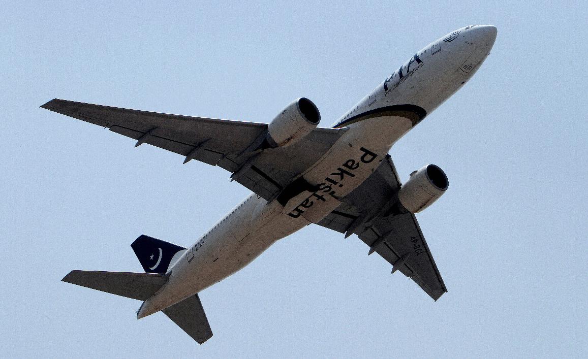 FILE - In this June 8, 2013 photo, a Pakistani International Airline plane takes off from Benazir Bhutto airport in Islamabad, Pakistan. (AP Photo/Anjum Naveed, File)
