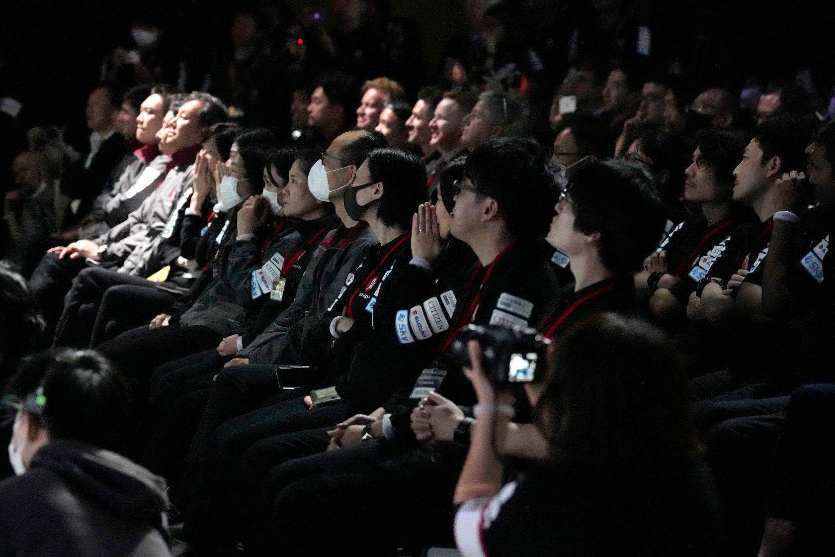 Takeshi Hakamada, founder and CEO of ispace, right, and his team staff watch livestream of HAKUTO-R private lunar exploration program on screen at the lunar landing event Wednesday, April 26, 2023, at Miraikan, the National Museum of Emerging Science and Innovation, in Tokyo. Tokyo's ispace tried to land its own spacecraft on the moon early on Wednesday, but its fate was unknown as flight controllers lost contact with it moments before the planned touchdown. (AP Photo/Eugene Hoshiko)