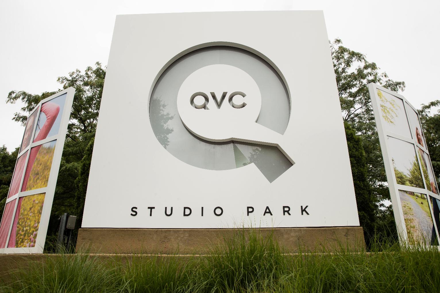 FILE - Corporate signage is shown outside a QVC facility in West Chester, Pa., Friday, July 7, 2017. (AP Photo/Matt Rourke, File)