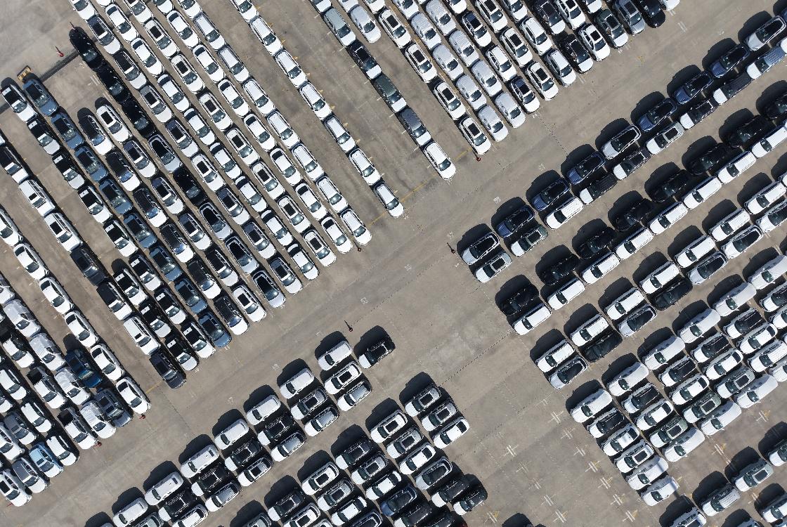 FILE -An aerial view of new cars awaiting export to oversea markets is seen at a port in Shanghai, March 10, 2026. (Chinatopix via AP, File)