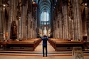 FILE - A tourist takes a picture inside the Cologne Cathedral in Cologne, Germany, Wednesday, Nov. 30, 2022. (AP Photo/Michael Probst, File)