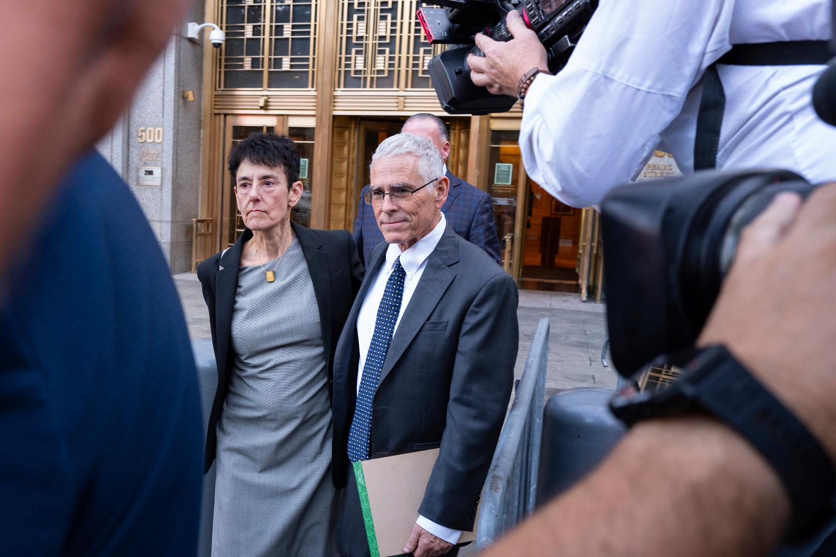 Barbara Fried and Joseph Bankman, parents of FTX founder Sam Bankman-Fried, leave a Manhattan federal courthouse on the opening day during the fraud trial of their son Bankman-Fried, Wednesday, Oct. 4, 2023, in New York. (AP Photo/Craig Ruttle)
