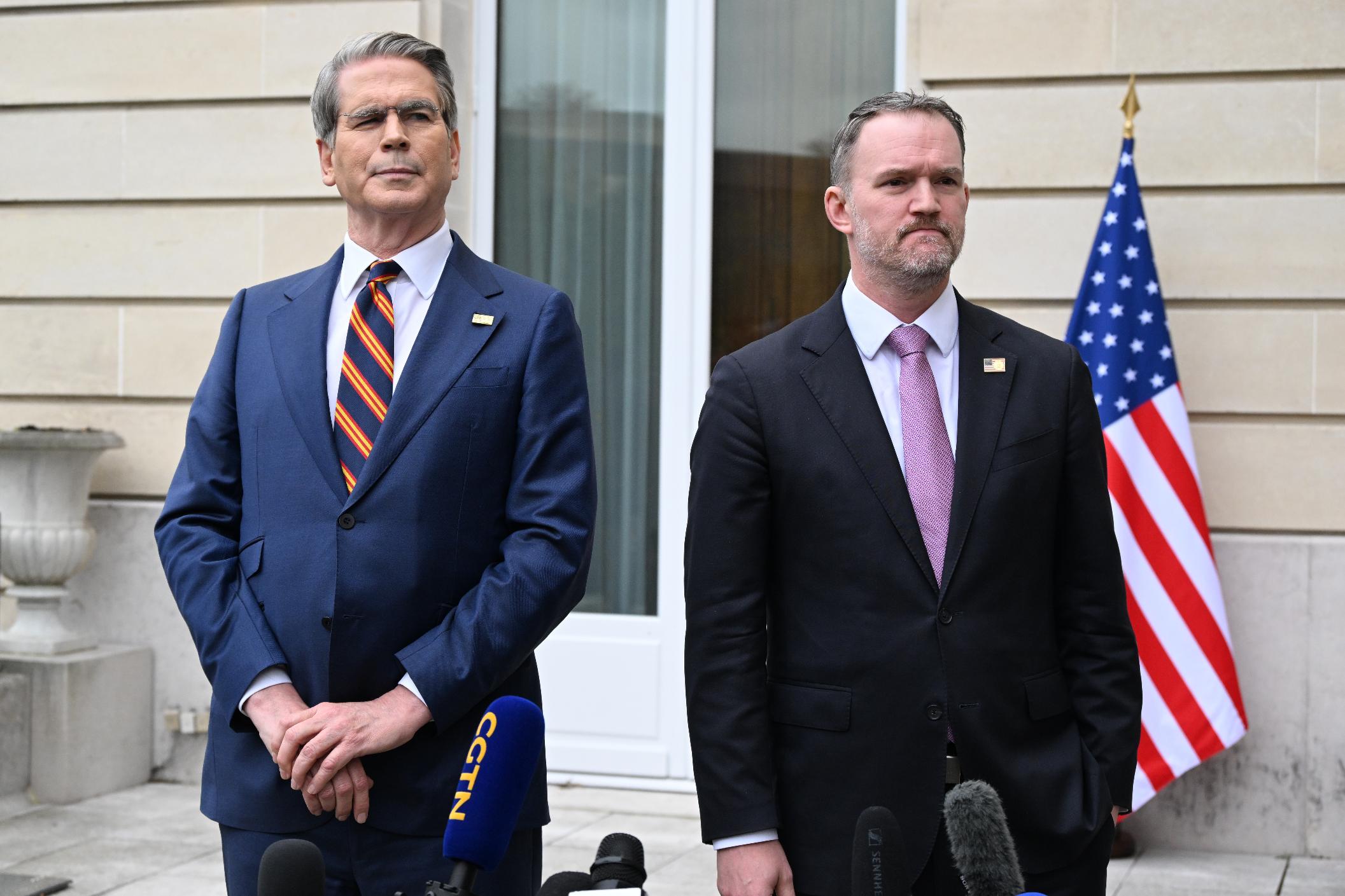US Treasury Secretary Scott Bessent, left, addresses journalists during a news conference with US Trade Representative Jamieson Greer, right, at the OECD Headquarters, Monday, March 16, 2026, in Paris, France. (AP Photo/Emma Da Silva)
