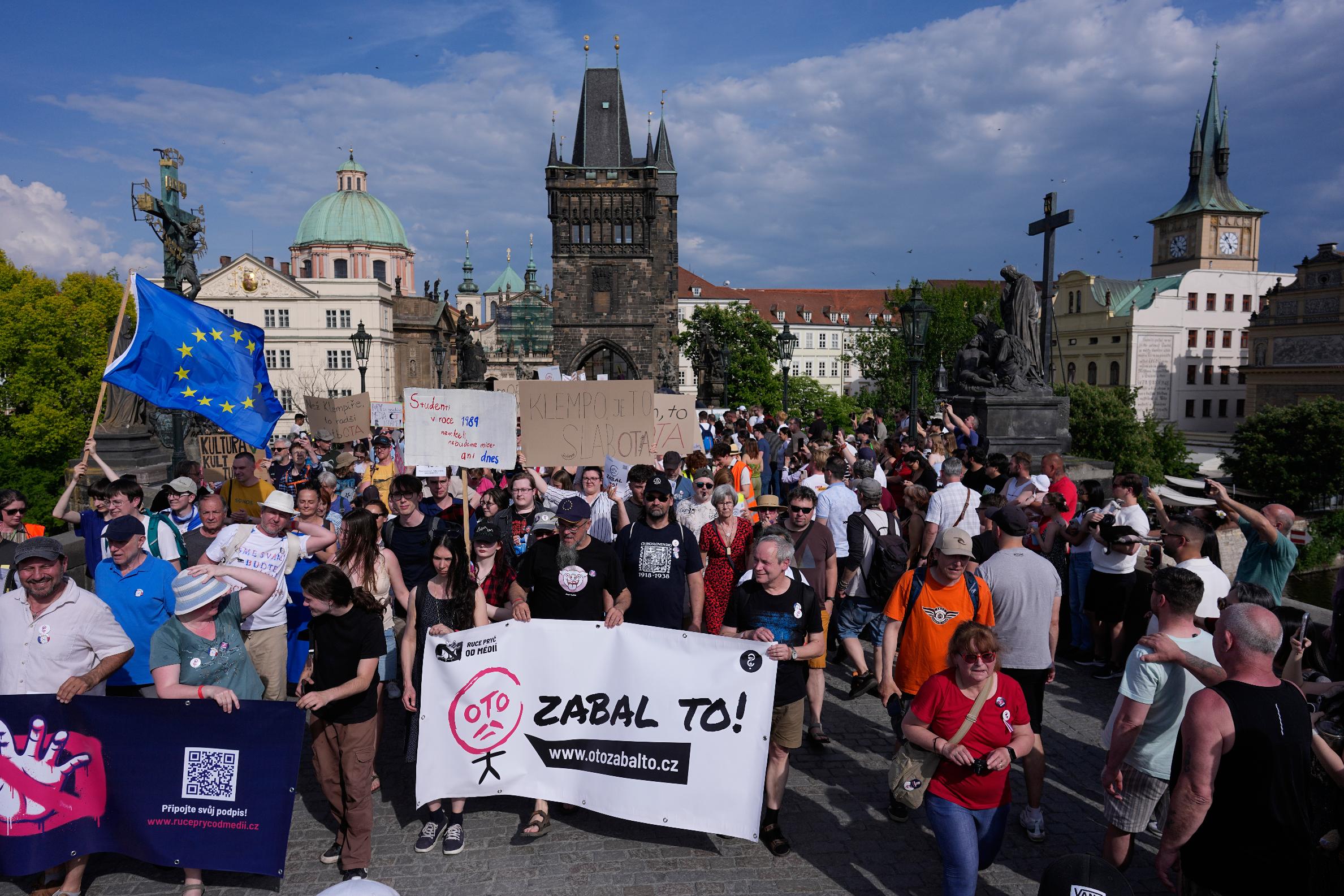 Thousands of people march to protest against a government plan to change public broadcaster funding in Prague, Czech Republic, Sunday, May 24, 2026. (AP Photo/Petr David Josek)