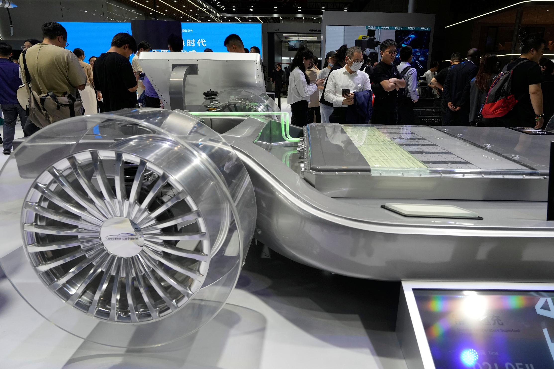 Visitors look at the fast charging battery from CATL that promises 520km from 5 minutes of charging at the Shanghai auto show on Wednesday, April 23, 2025. (AP Photo/Ng Han Guan)