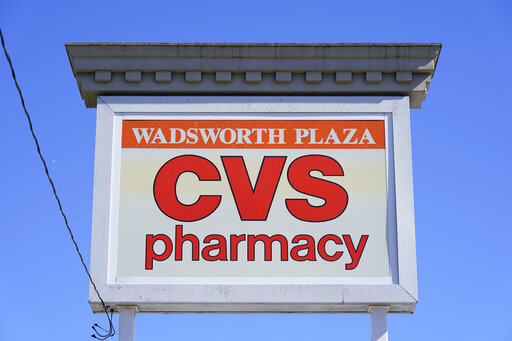 CVS sign is shown in Wadsworth Plaza in Philadelphia, Wednesday, Sept. 29, 2021. CVS Health shares tumbled early Friday, Oct. 7, 2022, after the company said a big Medicare Advantage plan took a hit in government quality ratings about a week before a key enrollment window opens for the coverage. (AP Photo/Matt Rourke)