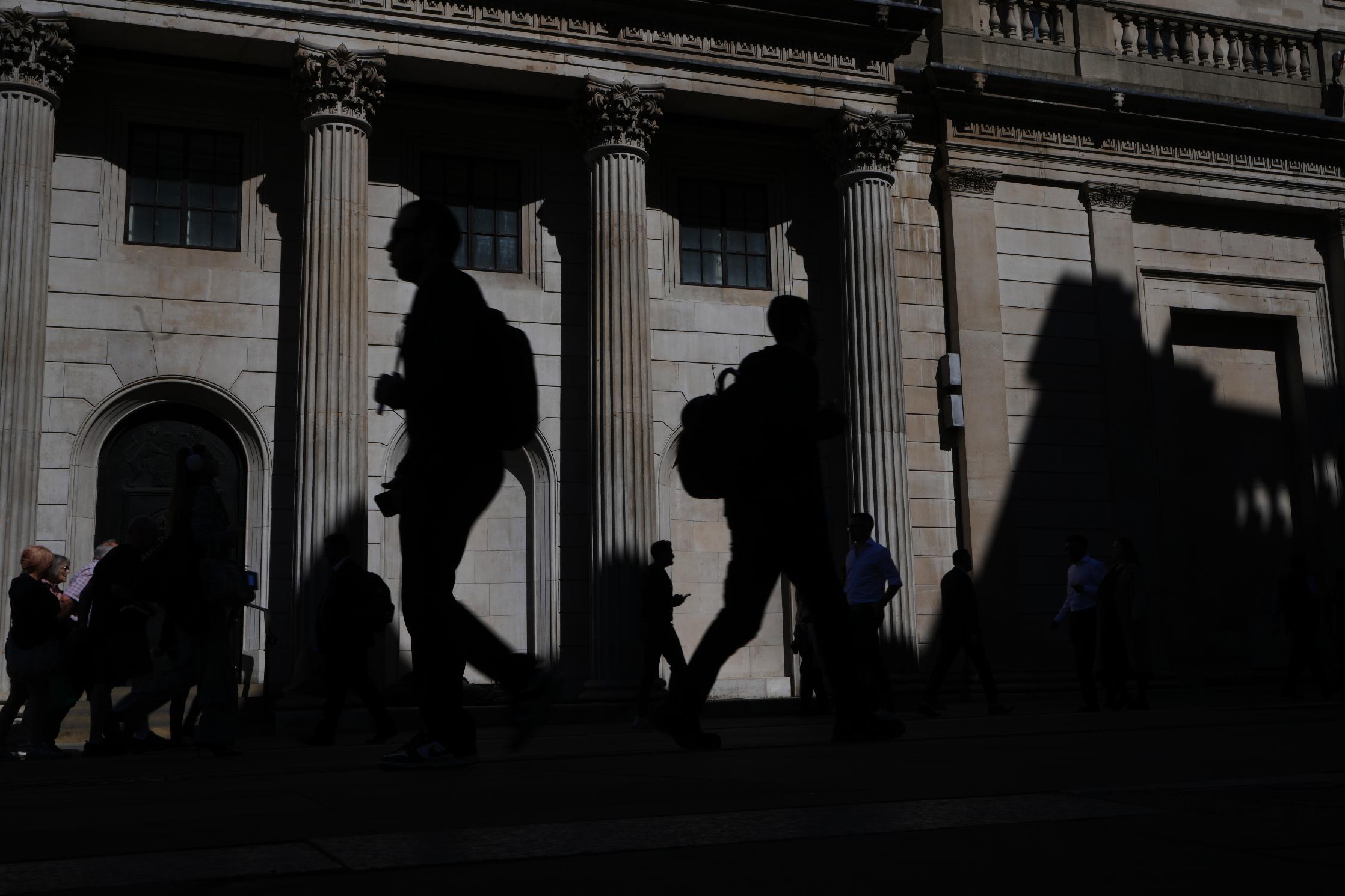 FILE -Pedestrians walk past the Bank of England in London, April 30, 2026. (AP Photo/Kirsty Wigglesworth, File)