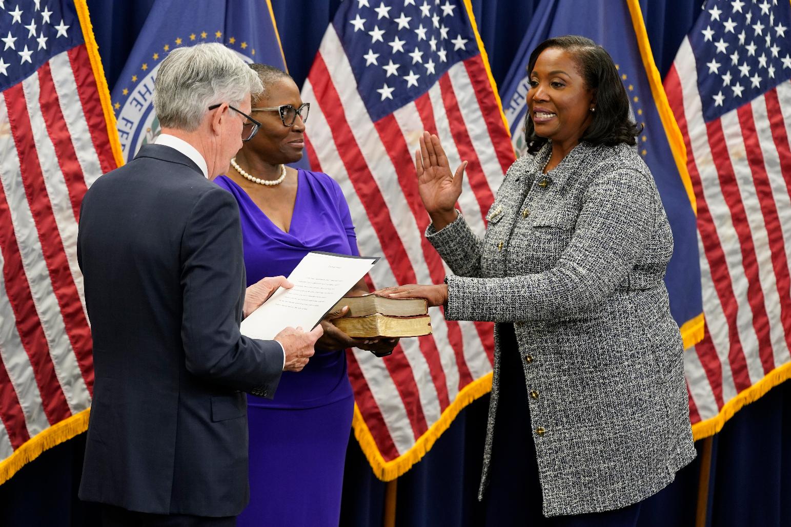FILE - Lisa Cook, right, takes the oath of office to become a member of the Federal Reserve Board, May 23, 2022, in Washington. (AP Photo/Patrick Semansky, file)