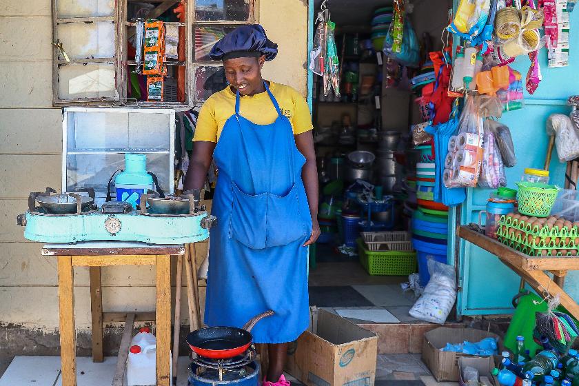 FILE - Grace Kathambi uses a bioethanol fuel stove to fry and sell French fries at her shop in Kibera, an informal settlement on the outskirts of Nairobi, Kenya, on Feb. 4, 2026. (AP Photo/Atieno Muyuyi, File)
