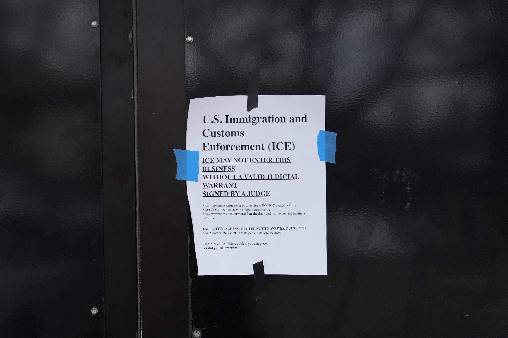 FILE - A sign is taped to the outside of the 24 Somali Mall in Minneapolis, Jan. 15, 2026. (AP Photo/Abbie Parr, File)