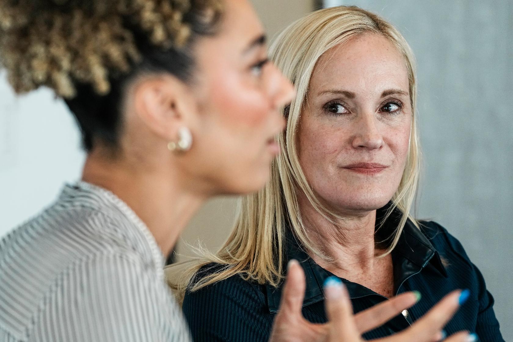 Kristin Lemkau, CEO, J.P. Morgan Wealth Management, listens to Ally Love, Peloton Instructor + VP, Instructor Strategy & Development, during an interview after taking part in a Pro Athlete event at JPMorganChase headquarters in New York, Wednesday, March 18, 2026. (AP Photo/Eduardo Munoz Alvarez)