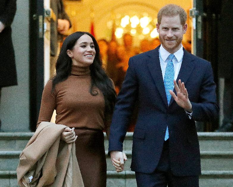 FILE - In this Jan. 7, 2020, file photo, Britain's Prince Harry and Meghan, Duchess of Sussex leave Canada House in London. (AP Photo/Frank Augstein, File)