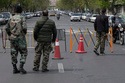 Members of the Basij paramilitary force stand at a checkpoint in Tehran, Iran, Sunday, March 29, 2026. (AP Photo/Vahid Salemi)