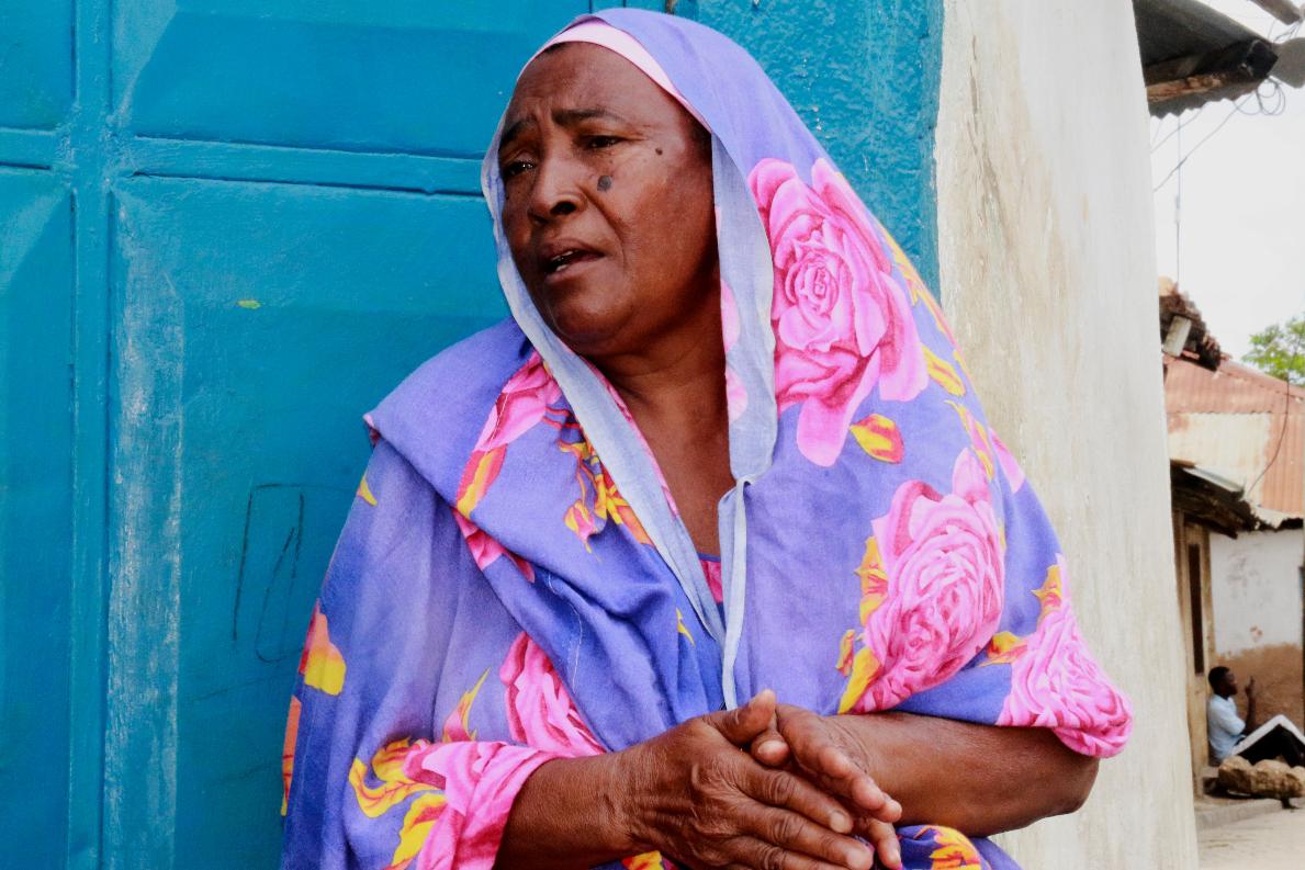 Mejumaa Hassan Nyanje, a mother of four born in Owino Uhuru village, sits outside her home in Mikindani, Mombasa County, Kenya, on April 10, 2026. (AP Photo/Kelvin Rading)