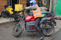 FILE - A rider sits on an electric Spiro motorcycle in Nairobi, Kenya, Tuesday, Feb. 24, 2026. (AP Photo/Henry Naminde, File)