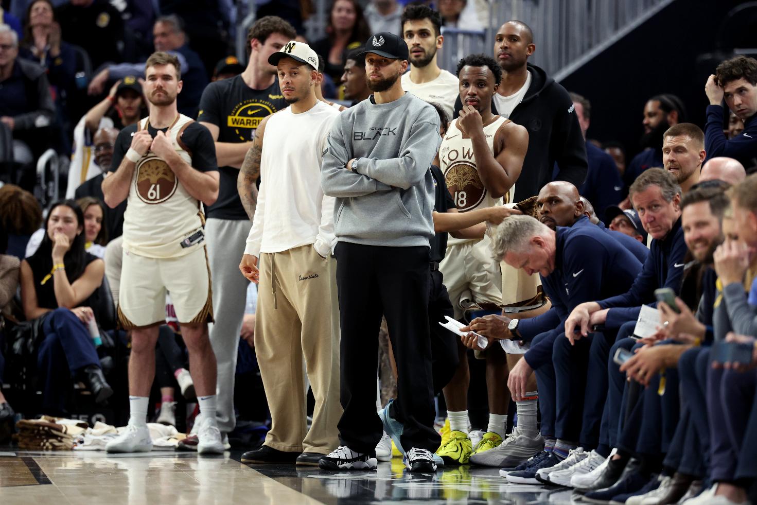 Golden State Warriors guard Stephen Curry watches from the bench during the second half of an NBA basketball game against the Brooklyn Nets in San Francisco, Wednesday, March 25, 2026. (AP Photo/Jed Jacobsohn)