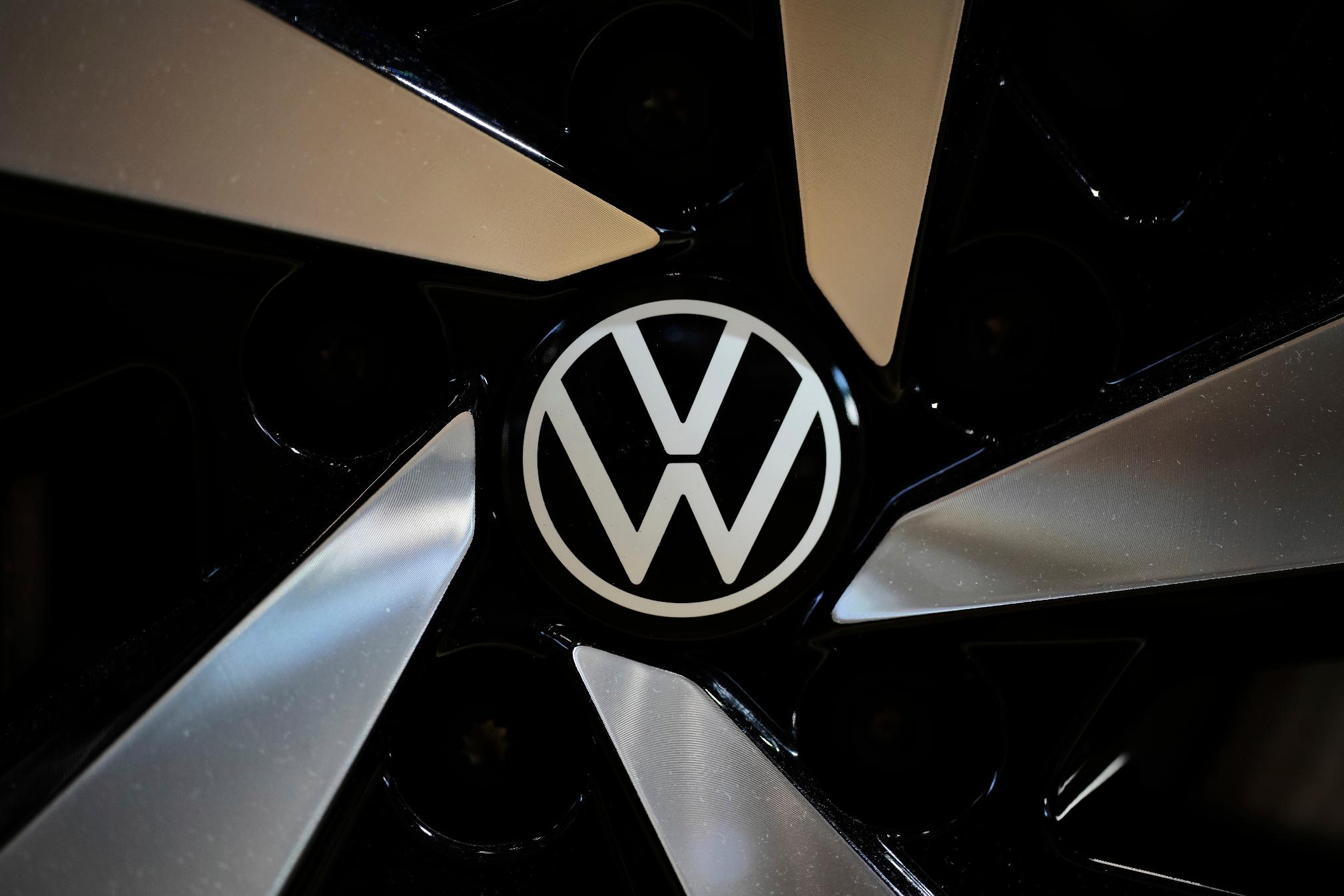 FILE - The logo of German car manufacturer Volkswagen is pictured at Volkswagen's transparent factory in Dresden, Germany, on May 14, 2025. (AP Photo/Matthias Schrader, File)