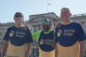 Sha Khan, center, poses in front of Buckingham Palace with his guide runners ahead of London Marathon 2026 in London, Thursday, April 23, 2026. (AP Photo/Mustakim Hasnath)