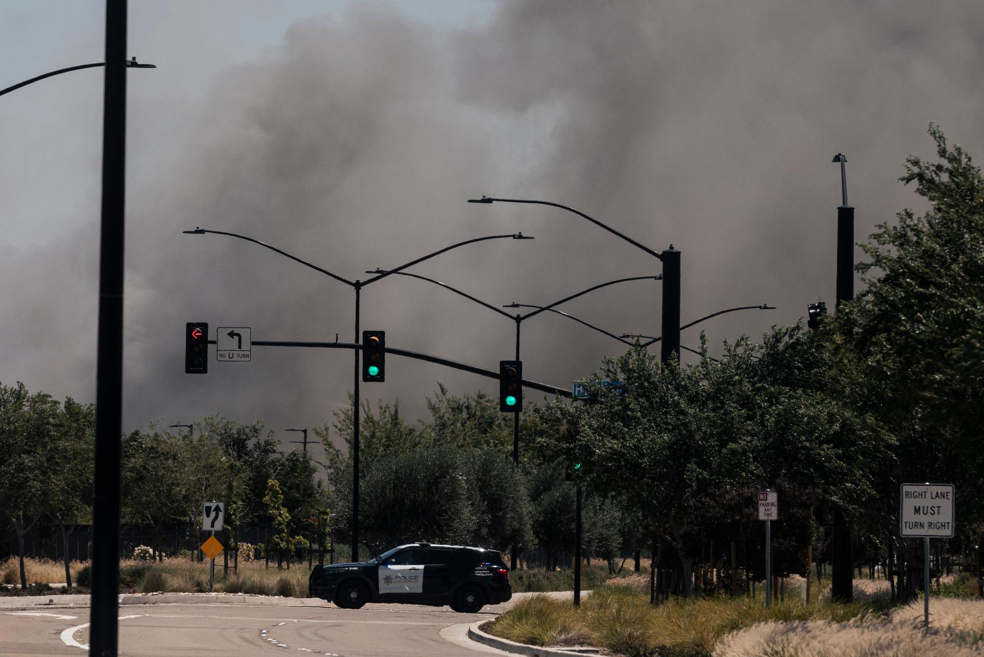 Smoke is seen from the massive fire at the Medline medical supply warehouse a million-foot facility, in Tracy, Calif., Friday, June 12, 2026. (Stephen Lam/San Francisco Chronicle via AP)