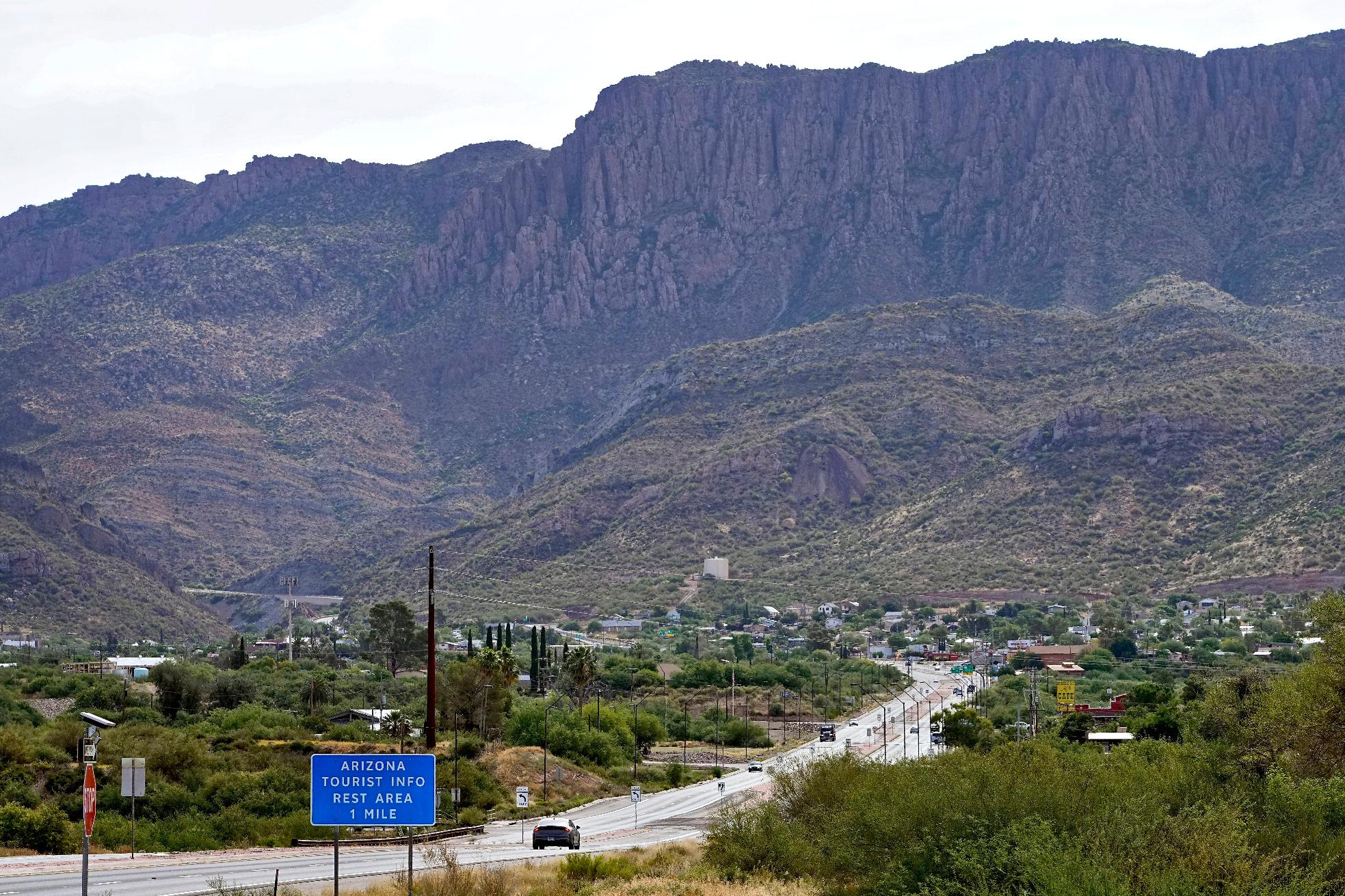 FILE - Apache Leap Mountain hovers over Superior, Ariz., June 9, 2023. (AP Photo/Matt York, File)
