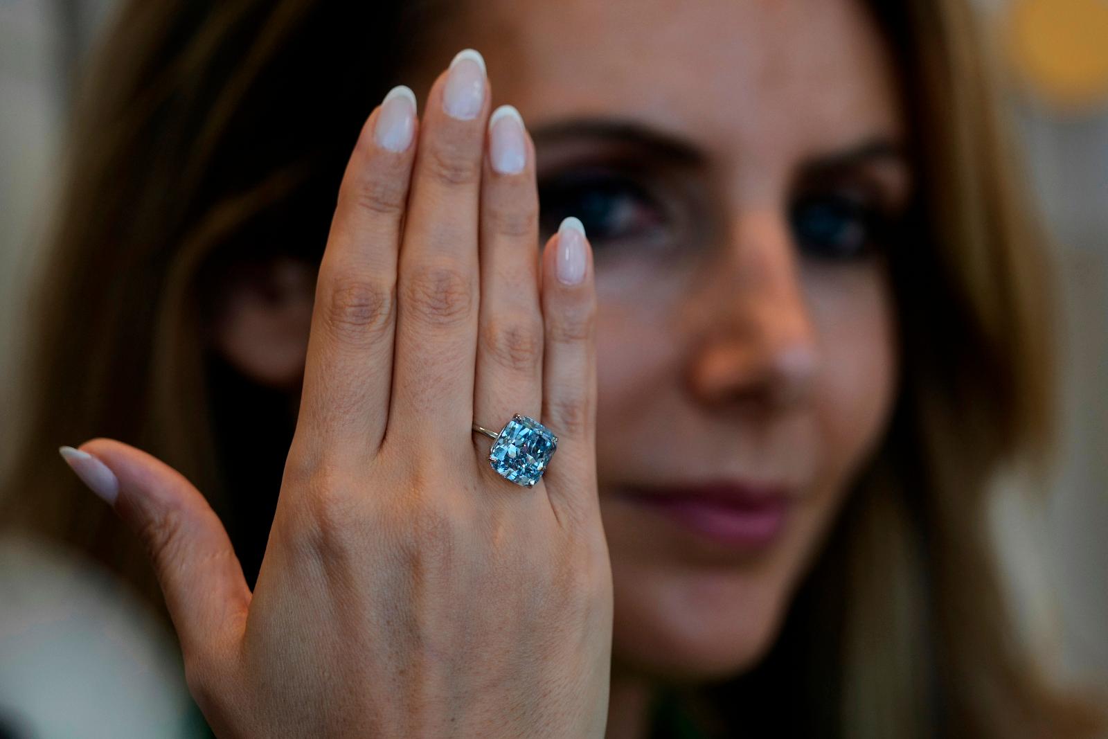FILE - Sotheby's Deputy Chairman, Middle East & Head of Sotheby's UAE, Katia Noun Boueiz wears the Mediterranean Blue diamond during its worldwide debut in Abu Dhabi, United Arab Emirates, Tuesday, April 8, 2025. (AP Photo/Altaf Qadri, file)