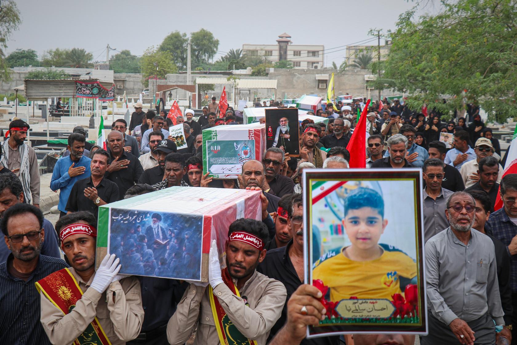 Mourners carry the coffins containing additional remains of victims identified through DNA testing during funeral ceremonies in Minab, Iran, Tuesday, July 22, 2026, nearly five months after they were killed in the Feb. 28 strike on the Shajareh Tayyebeh School.(Razieh Poudat/ISNA via AP)