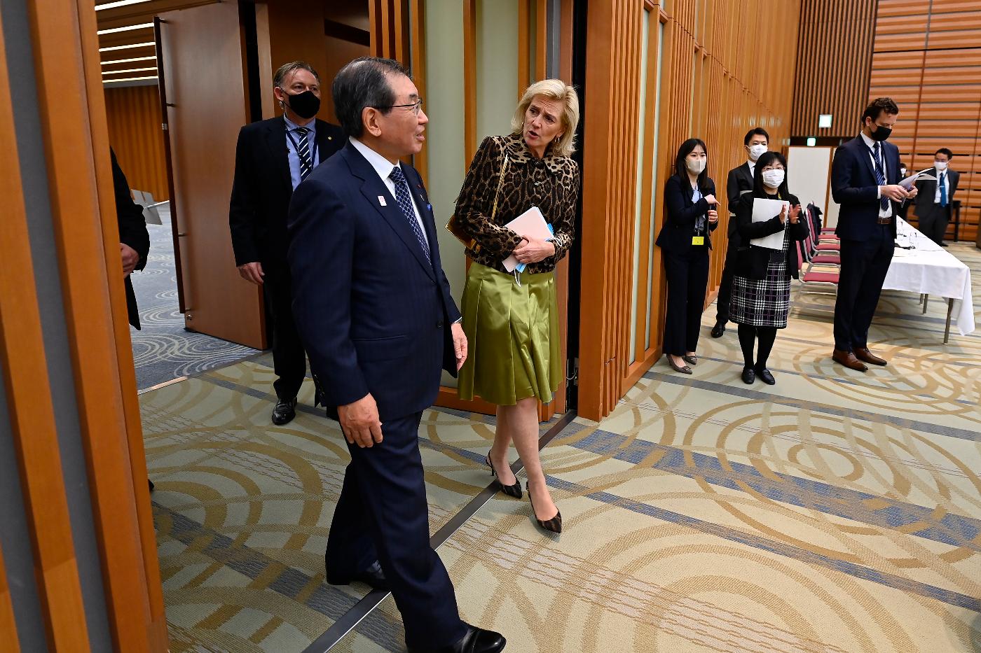 Princess Astrid of Belgium, center right, accompanied by Keidanren or Japan Business Federation Chairman Tokura Masakazu, center left, arrives at a luncheon meeting at the Keidanren in Tokyo Tuesday, Dec. 6, 2022. (David Mareuil/Pool Photo via AP)