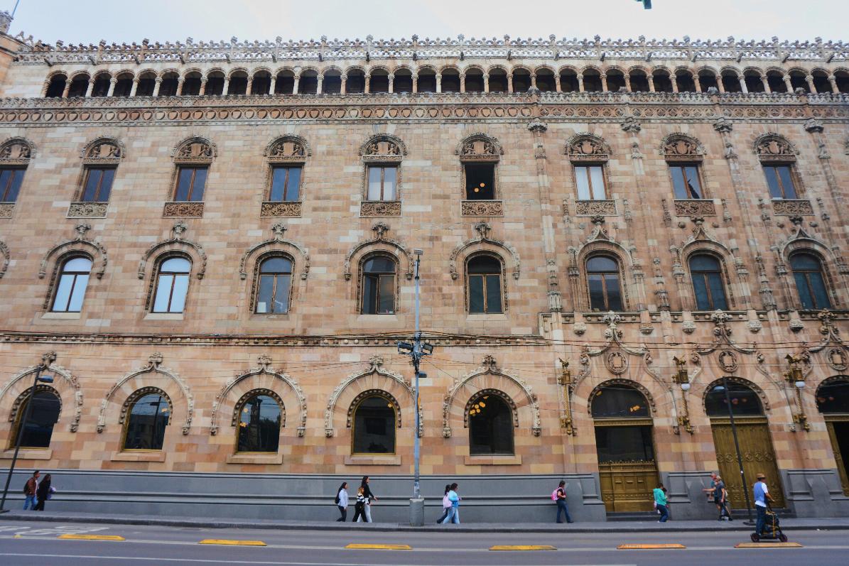 Pedestrians walk past the Main Post Office in Mexico City, Wednesday, Aug. 27, 2025. (AP Photo/Fernando Llano)