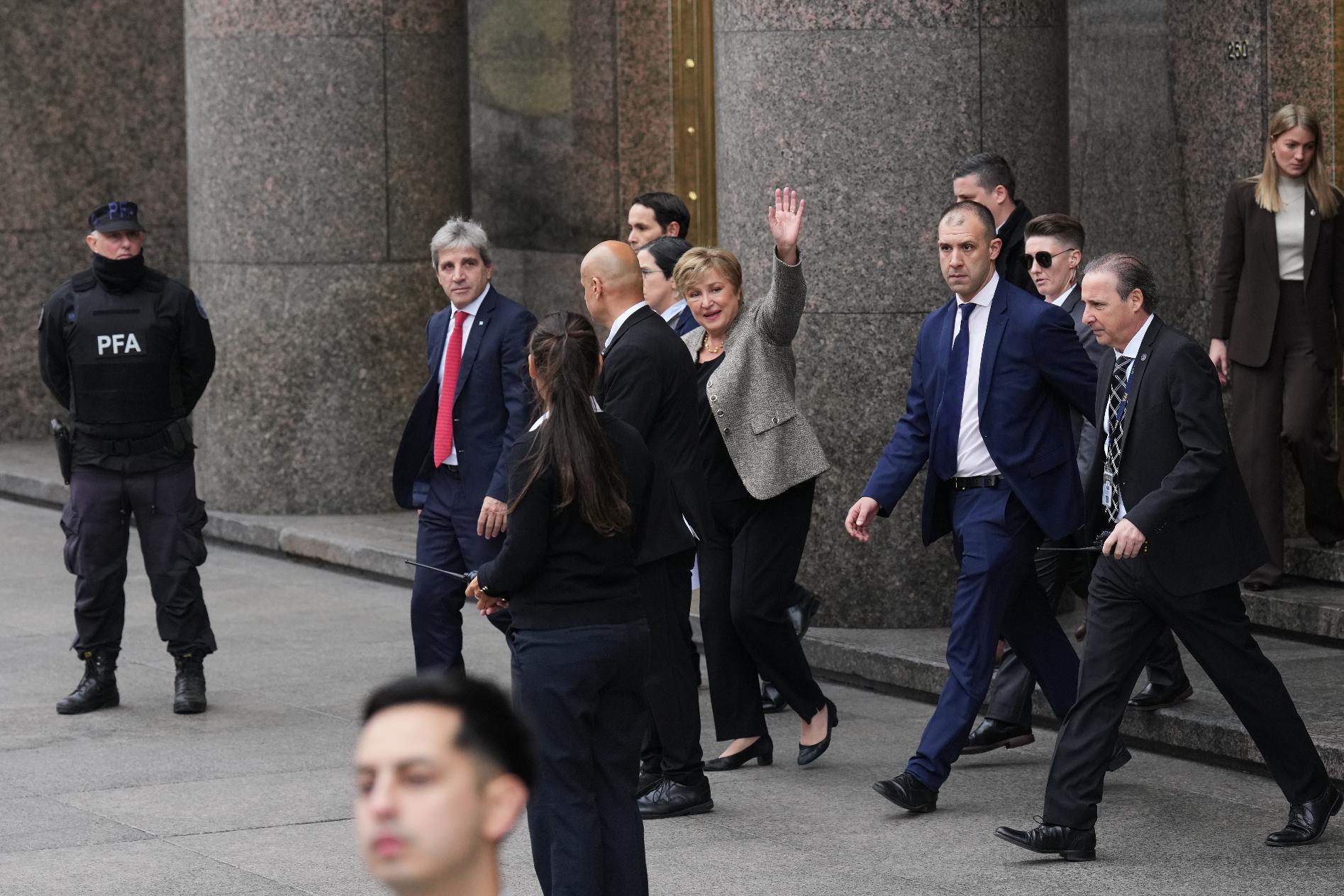 President of the International Monetary Fund Kristalina Georgieva waves as she leaves the Economy Ministry after a meeting with Argentina Economy Minister Luis Caputo, left, in Buenos Aires, Argentina, Monday, July 27, 2026. (AP Photo/Gustavo Garello)