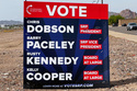 A sign supporting candidates for the Salt River Project board sits next to an intersection Monday, March 30, 2026 in Tempe, Ariz. (AP Photo/Jonathan J. Cooper)