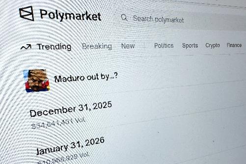 FILE - The Polymarket prediction market website is displayed on a computer screen, Jan. 11, 2026, in New York. (AP Photo/Wyatte Grantham-Philips, File)