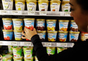 FILE -A shopper picks out General Mill's Haagen-Dazs ice cream at Piazza's grocery store in Palo Alto, Calif., June 28, 2011. (AP Photo/Paul Sakuma, File)