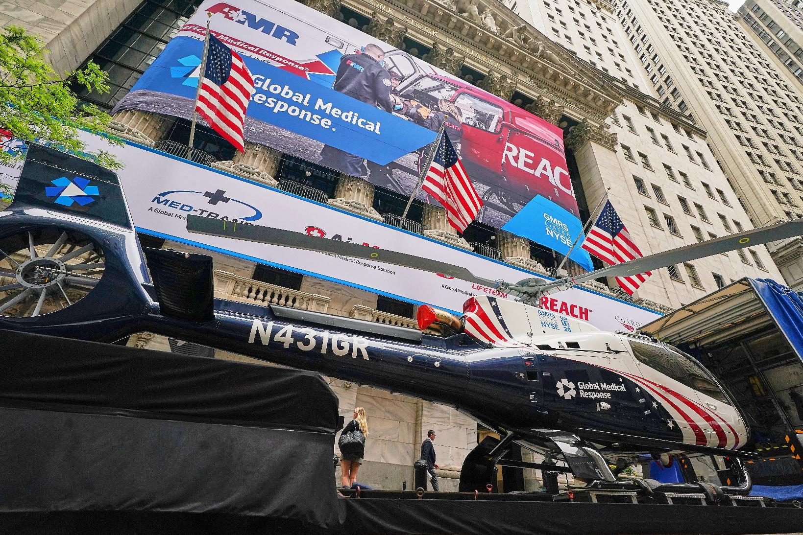A Global Medical Response helicopter sits in front of the New York Stock Exchange before the planned IPO of GMR Solutions, Inc., Wednesday, May 13, 2026. (AP Photo/Richard Drew)