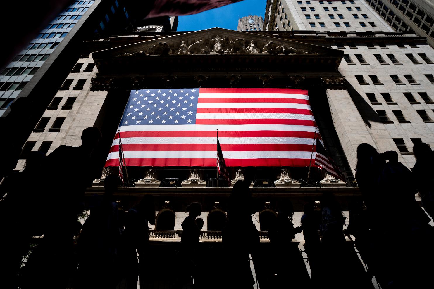 People walk past the New York Stock Exchange on Wednesday, June 29, 2022 in New York. Stocks are opening lower across the board on Wall Street, Tuesday, July 5, and crude oil prices are dropping again. Treasury yields also fell as traders continued to worry about the state of the economy (AP Photo/Julia Nikhinson)