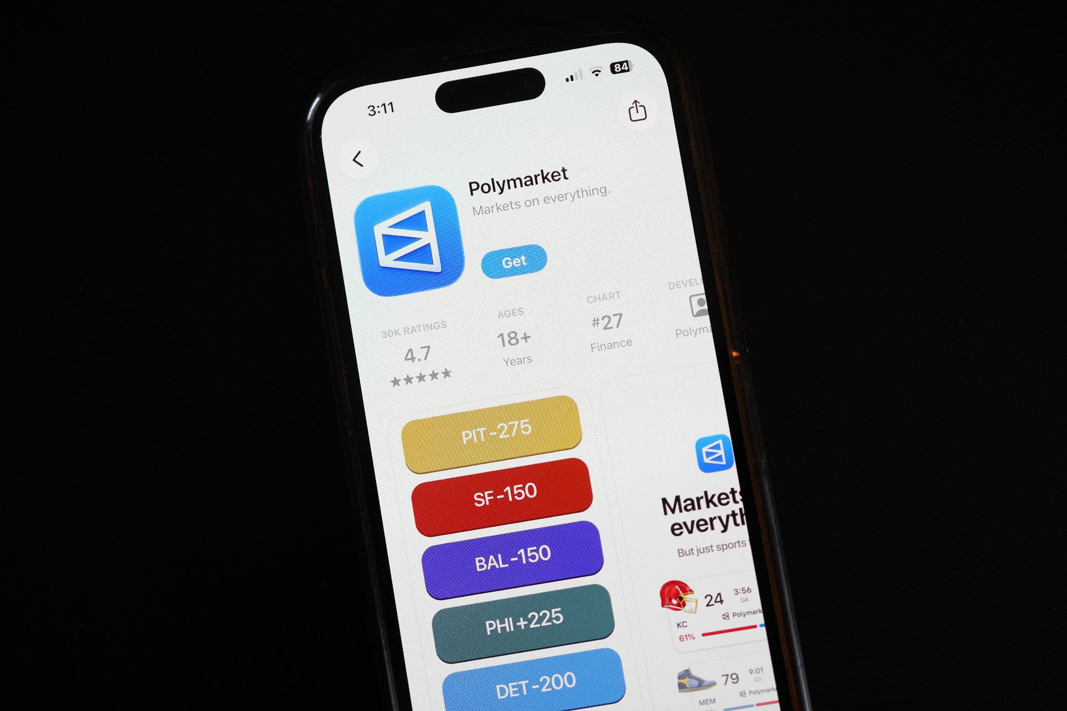 FILE - The prediction market app Polymarket is displayed on a mobile phone, April 16, 2026, in Chicago. (AP Photo/Erin Hooley, File)