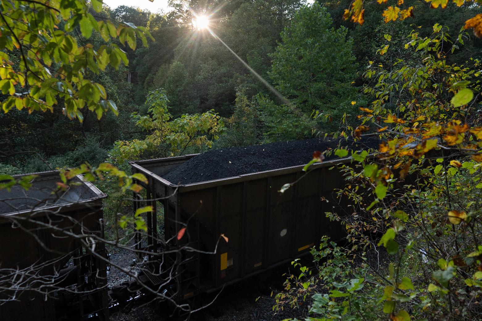A train car carrying coal moves through Oak Hill, W.Va, at sunset on Sept. 17, 2025. (AP Photo/Carolyn Kaster)