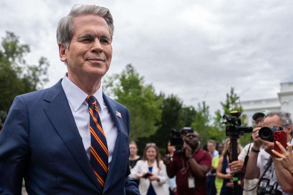 Treasury Secretary Scott Bessent walks past reporters following an interview with Fox News outside the White House, Thursday, July 30, 2026, in Washington. (AP Photo/Julia Demaree Nikhinson)