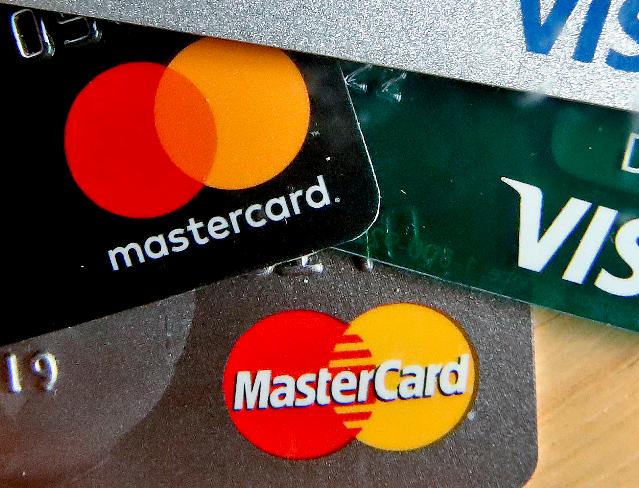FILE - In this Feb. 20, 2019, file photo are Mastercard and Visa credit cards in Zelienople, Pa. (AP Photo/Keith Srakocic, File)