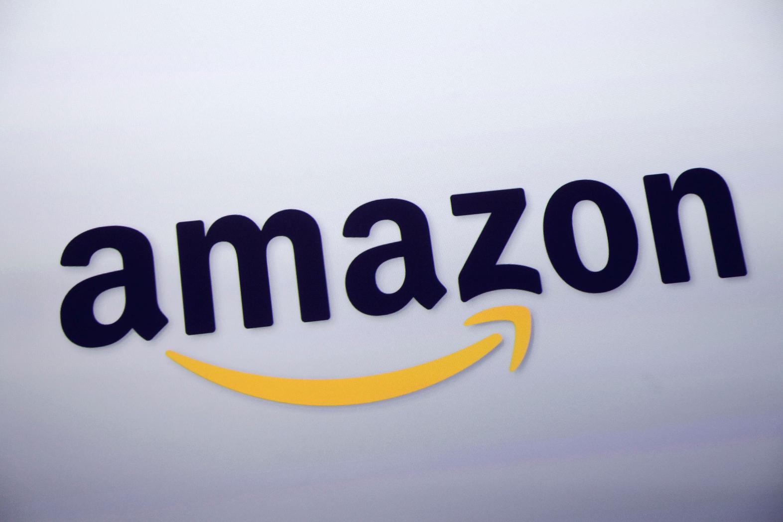 FILE - The Amazon logo is displayed at a news conference, Sept. 28, 2011, in New York. (AP Photo/Mark Lennihan, File)