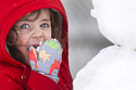 Louise Jordan, 3, eats snow while building a snowman near her home in Media, Pa. on Monday, Feb. 23, 2026. (Jose F. Moreno/The Philadelphia Inquirer via AP)