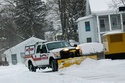 Rockingham, Vt., Fire Chief Shaun McGinnis removes snow from the Police/Fire Station on Monday, Jan. 26, 2026, after Winter Storm Fern dropped several inches of snow. (Kristopher Radder/The Brattleboro Reformer via AP)