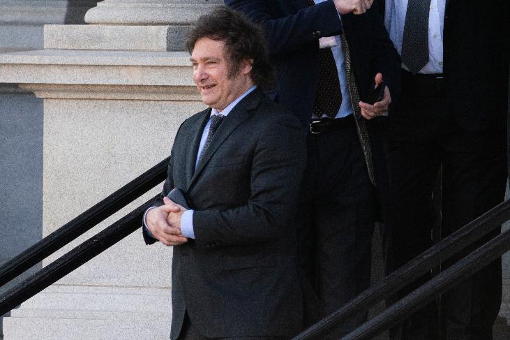 Argentina's President-elect Javier Milei walks down the steps of the Eisenhower Executive Office Building on the White House campus after a meeting with National Security Adviser Jake Sullivan, Tuesday, Nov. 28, 2023, in Washington. (AP Photo/Evan Vucci)