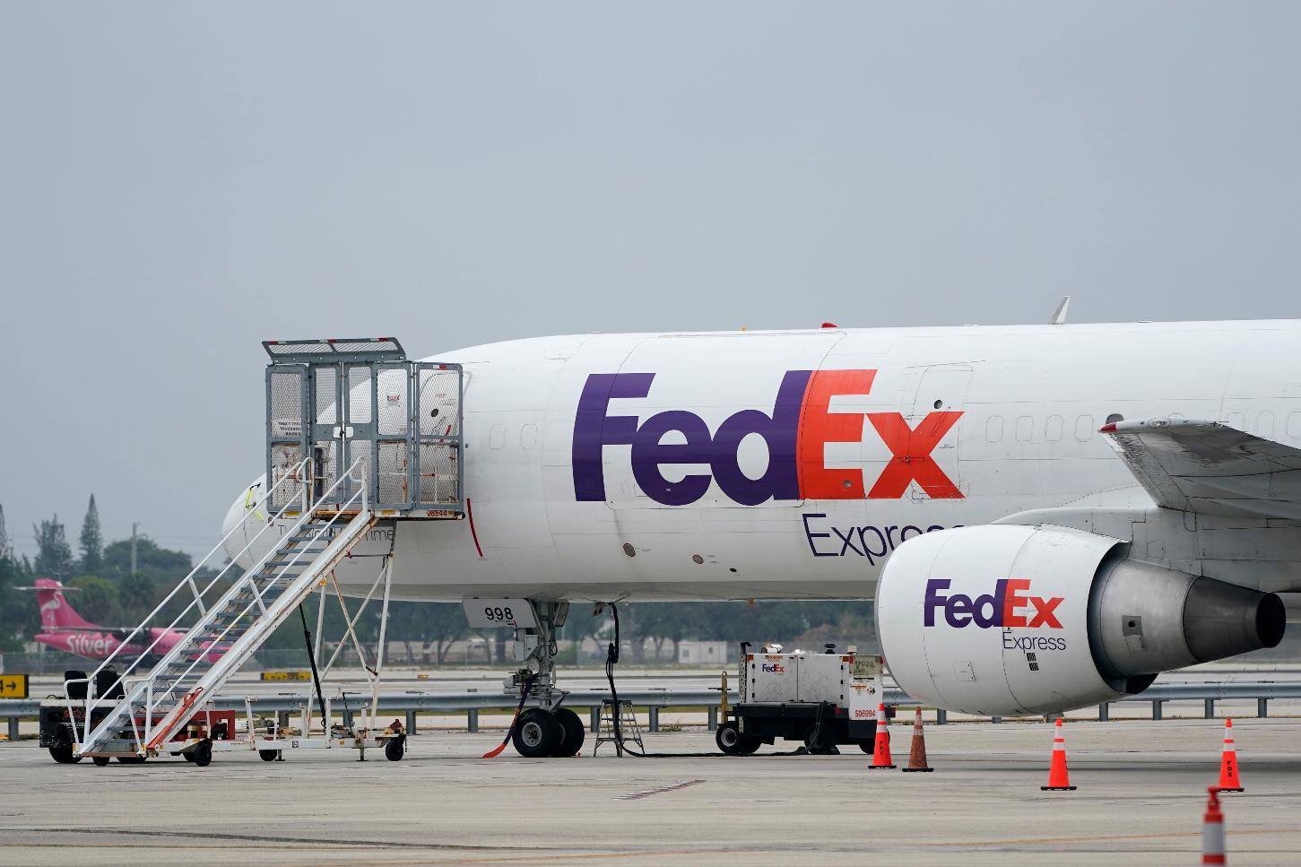 FILE-A FedEx cargo plane is shown on the tarmac at Fort Lauderdale-Hollywood International Airport, Tuesday, April 20, 2021, in Fort Lauderdale, Fla. (AP Photo/Wilfredo Lee, File)