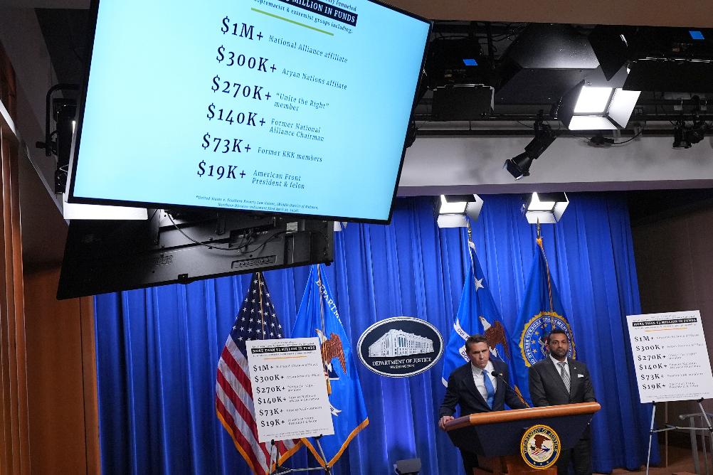 FILE - Acting Attorney General Todd Blanche speaks as FBI Director Kash Patel listens during a news conference at the Justice Department, April 21, 2026, in Washington. (AP Photo/Jacquelyn Martin, File)