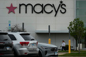 FILE - A Macy's sign is displayed outside the department store in Gurnee, Ill., Wednesday, April 15, 2026. (AP Photo/Nam Y. Huh, file)